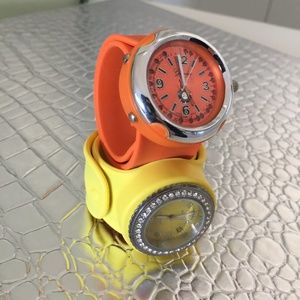 ONE YELLOW AND ONE ORANGE RUBBER WRAP AROUND WATCH FUN AND EASY TO WEAR NEED BAT